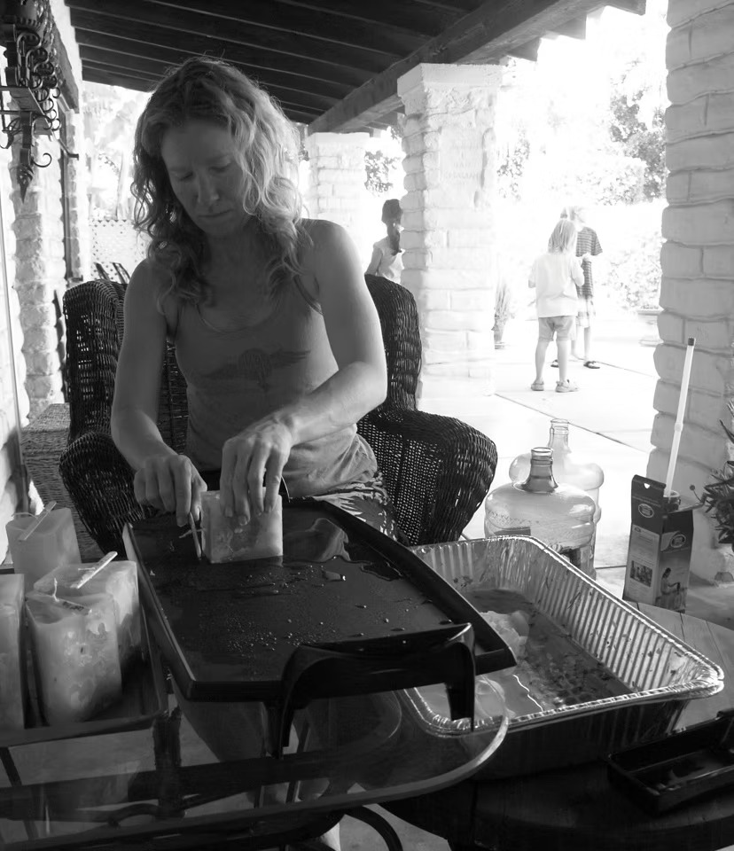 Glow Candle Lounge founder Jennifer Rubin hand-making a candle