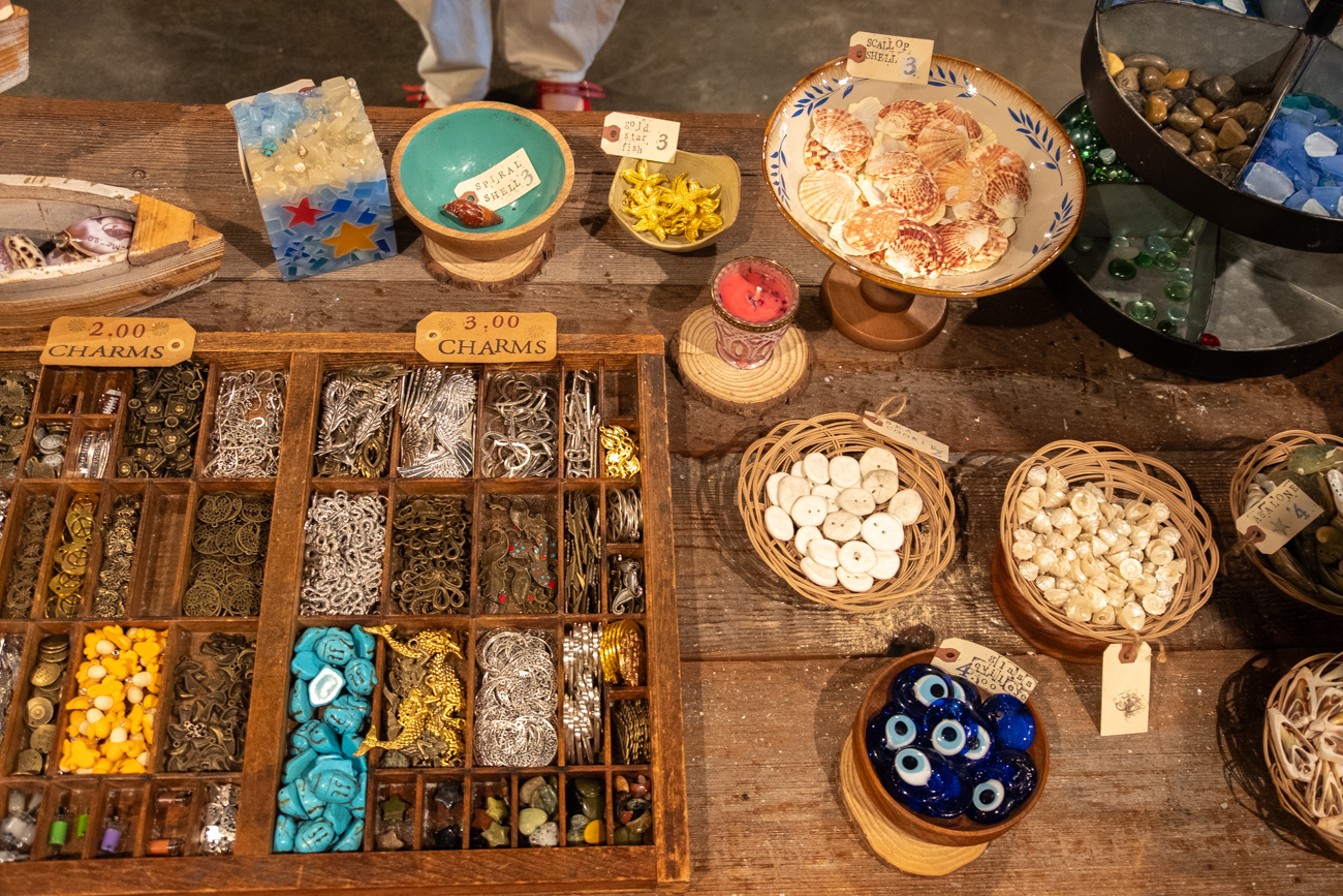 Charms, shells, and decorations display at Glow Candle Lounge