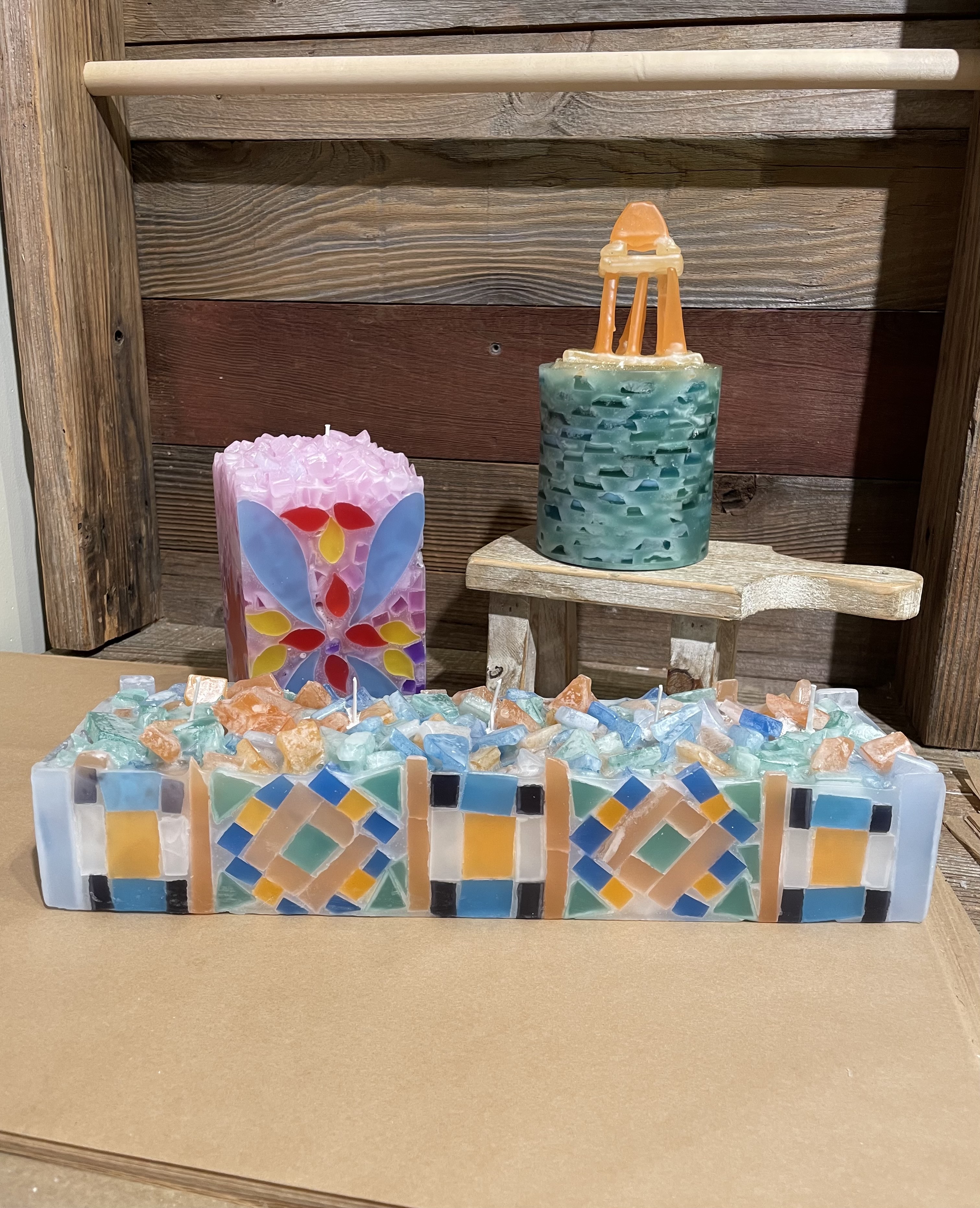 Finished handmade candles lined up at Glow Candle Lounge