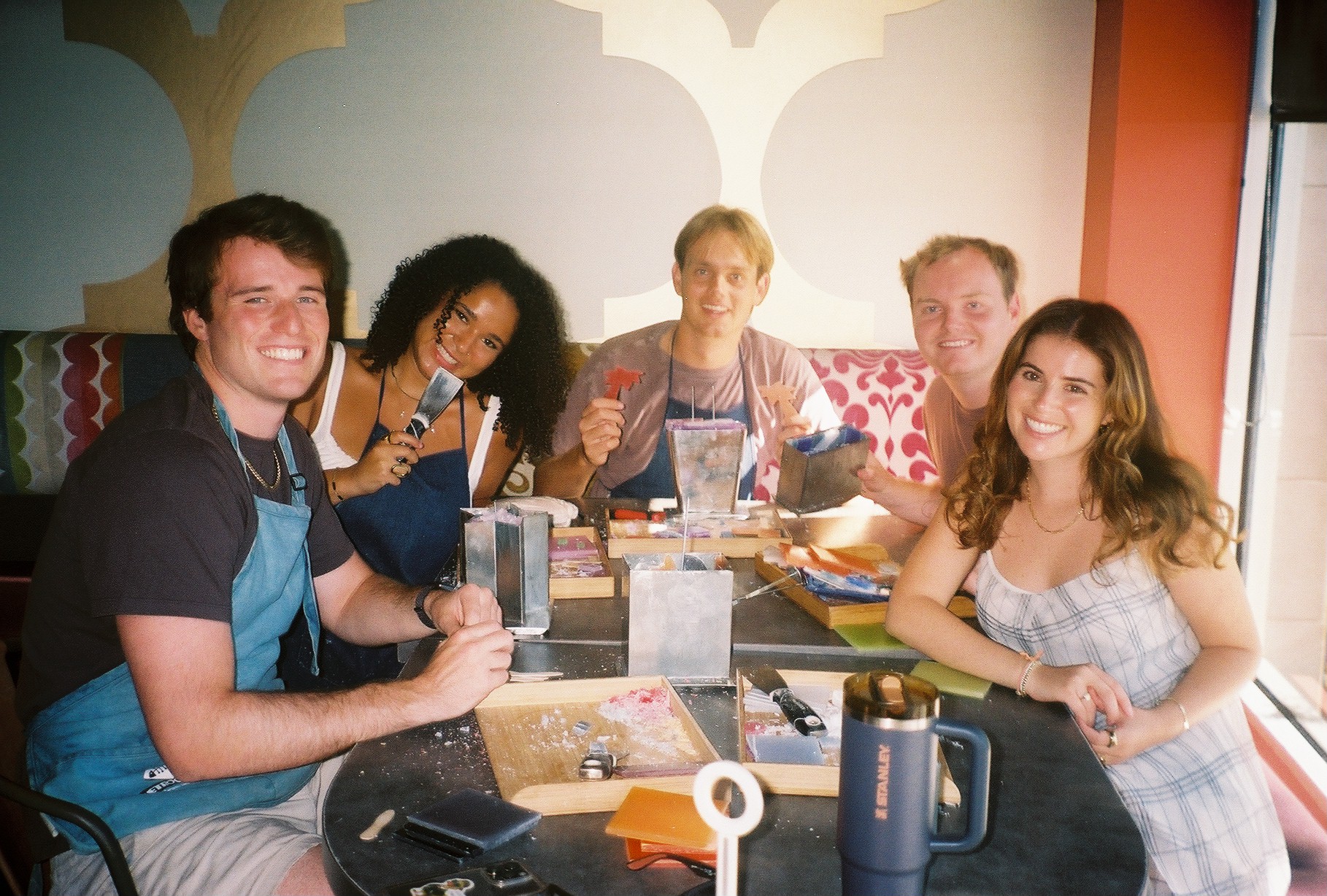 Friends celebrating a birthday making candles at Glow Candle Lounge