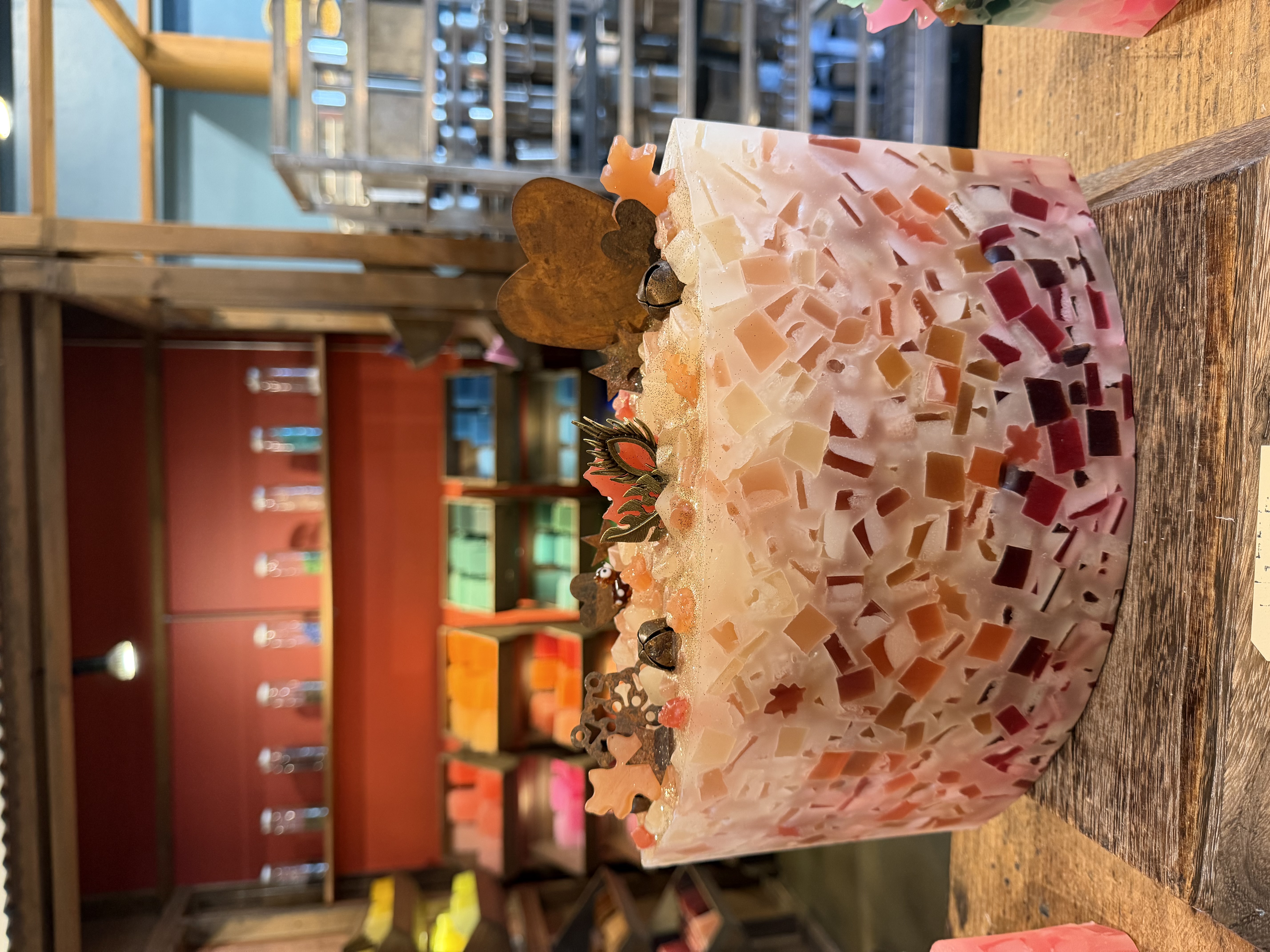 A colorful mosaic candle made at Glow Candle Lounge